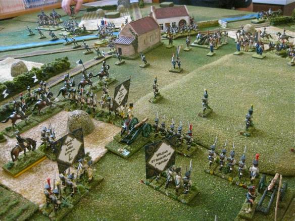 Westphalian infantry (division) advances to the base of the hill before them. French mill about the village. Westphalian chevau-legers prepare to chase away the French skirmishers.